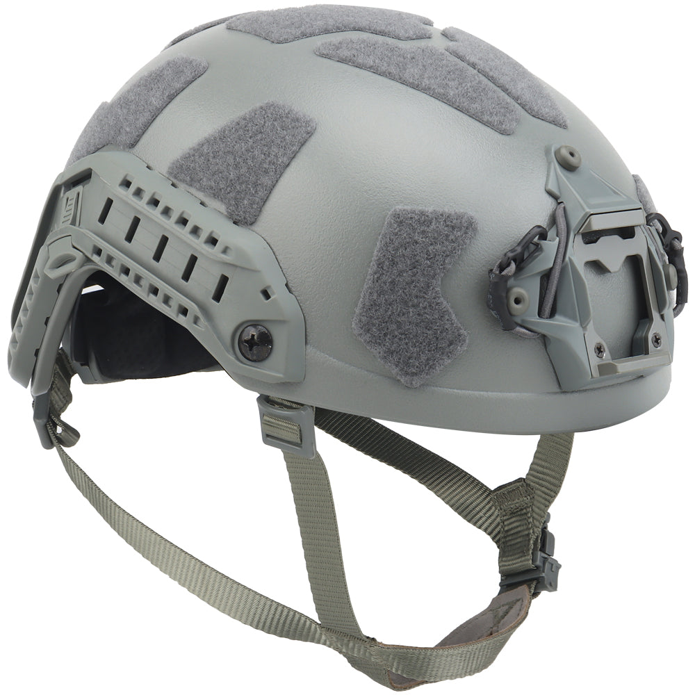 The image displays a Striketact Tactical Ballistic Safety Helmet in grey during an outdoor military simulation, showing full-head coverage, ventilation padding, and its use in tactical training or paintball scenarios.