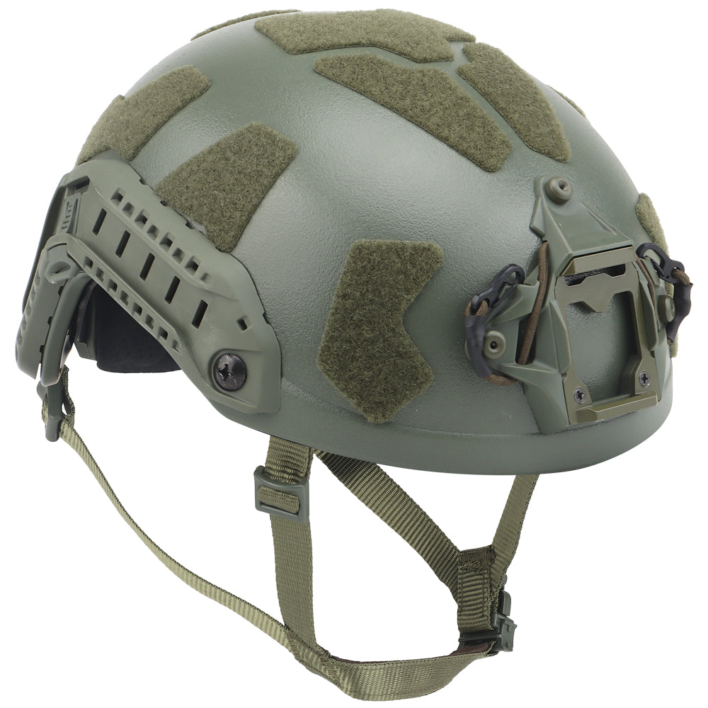 The image displays a Striketact Tactical Ballistic Safety Helmet in green during an outdoor military simulation, showing full-head coverage, ventilation padding, and its use in tactical training or paintball scenarios.
